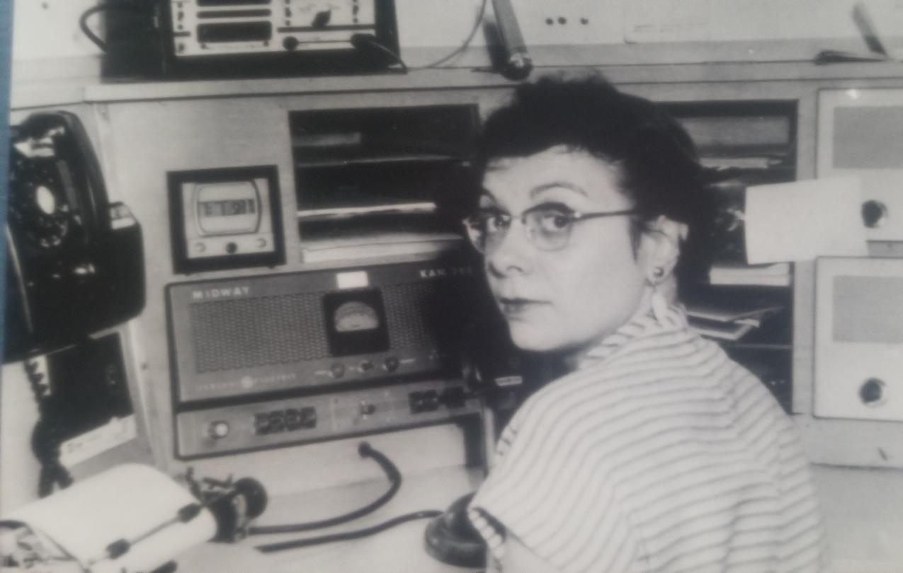 Mitzie Pernu at the radio while on the job as a 911 dispatcher in 1963